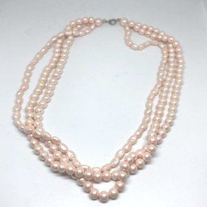 Multi strand beaded pearl necklace.